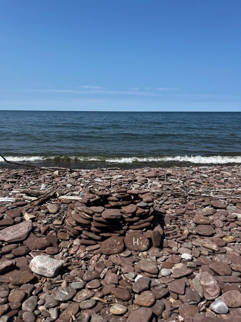lake shore line with fire pit rock pile