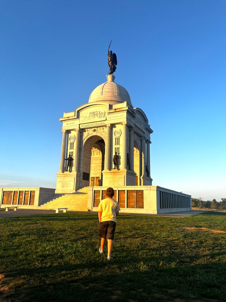Boy walking up to Gettysburg monument